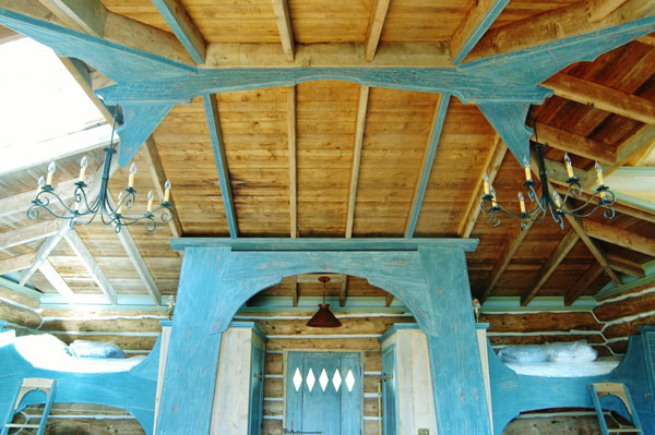 photo of restored naskeag cabin rafters and chandeliers