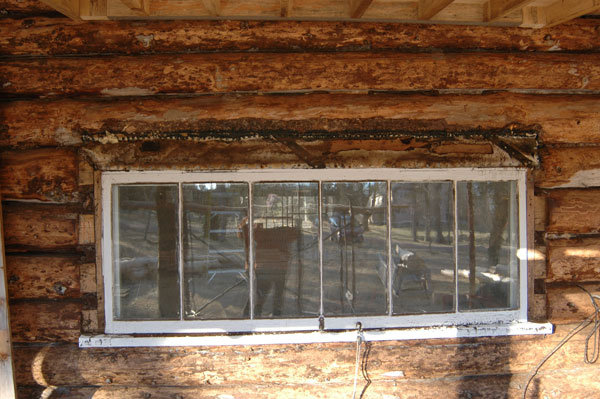 photo of naskeag cabin exterior wall before restoration