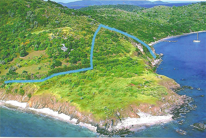 aerial view of propert on lovango cay with property line marked in blue 